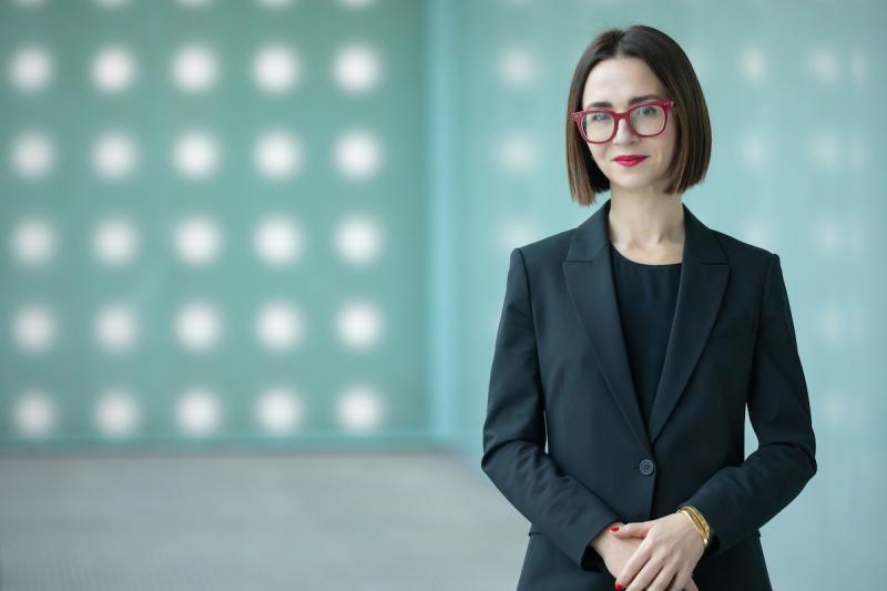 Molly Rowe, the new director at the Hilliard Art Museum stands in the museum gallery.