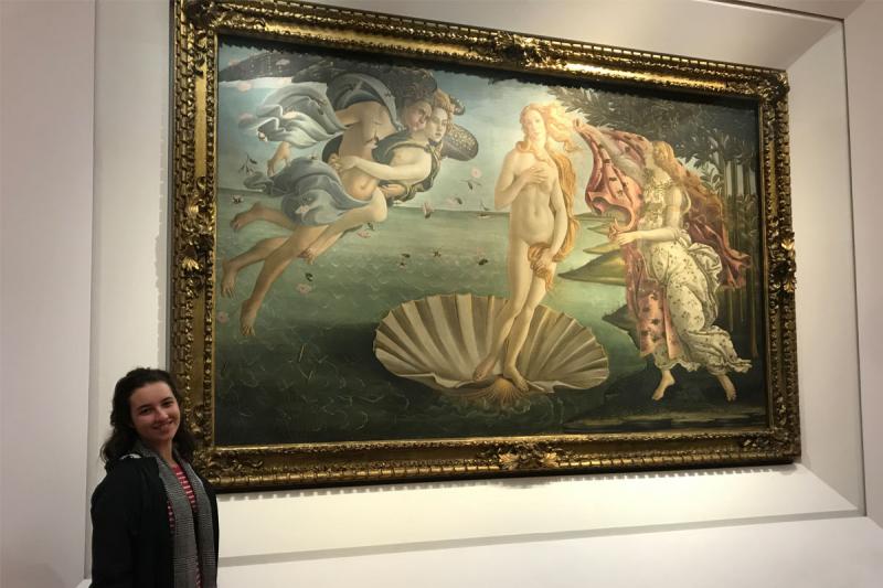 University of Louisiana at Lafayette art education major Caroline Stearns stands in front of The Birth of Venus painting