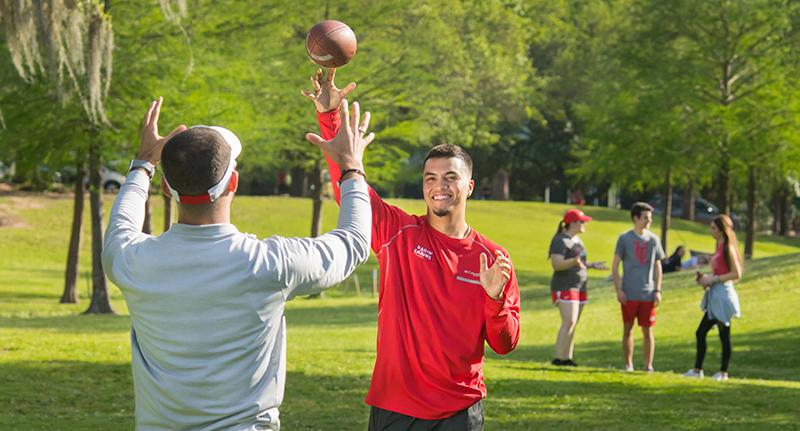 UL Lafayette students play basketball in Girard Park