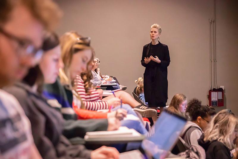 University of Louisiana at Lafayette professor speaks in front of a full classroom