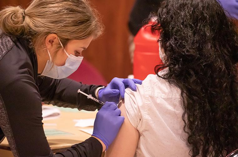 Student receiving COVID vaccine on campus