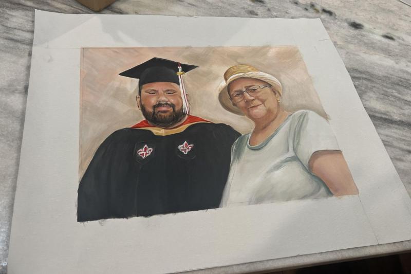 In an illustration, Zach Badon, clad in his cap and gown, poses with his grandmother, who passed away before she could see him graduate.