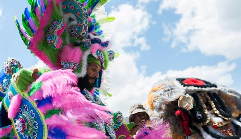 Man in feathered headress at Festival International