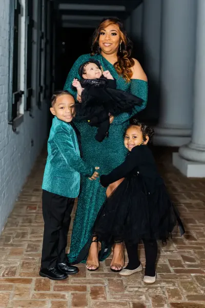 Halle Castille and her three young children, all dressed in matching sparkly teal outfits, pose for a photo in front of the Hilliard Art Museum on UL Lafayette's campus.