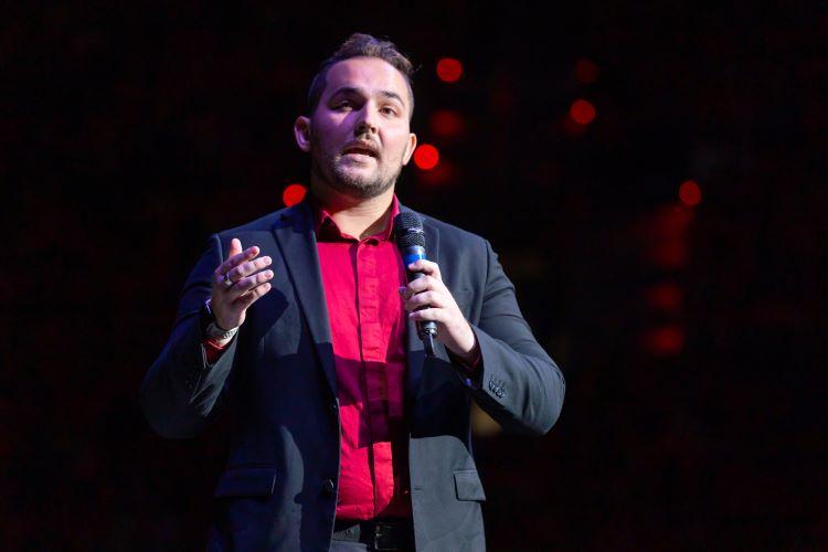 An upperclassmen student speaking at New Student Convocation at the Cajundome