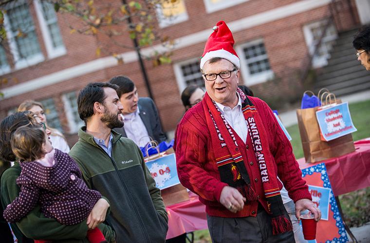 Dr. Savoie in a Santa hat a Sneaux Day