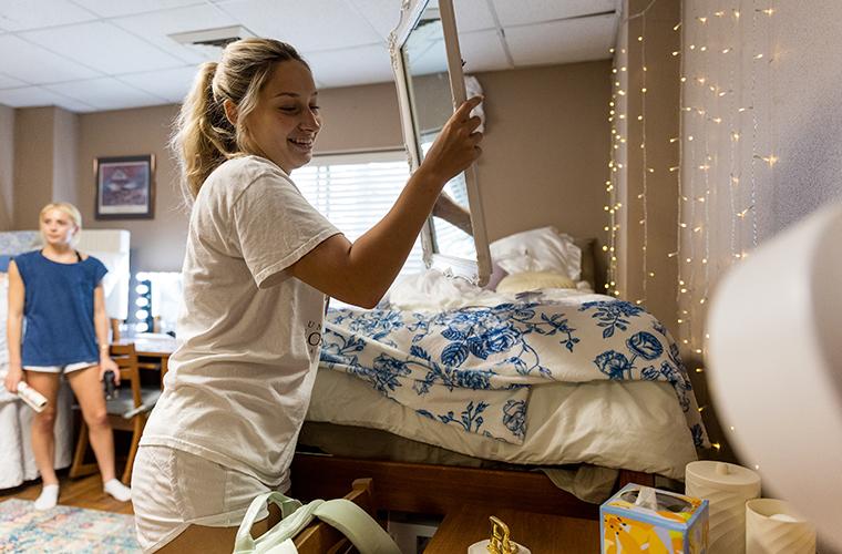 UL Lafayette freshman unpacks in her dorm room