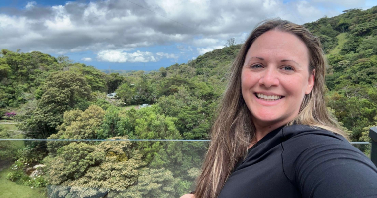 Amanda Devillier, a student in UL Lafayette's online MBA program, takes a selfie on a balcony overlooking a lush Costa Rican rainforest.
