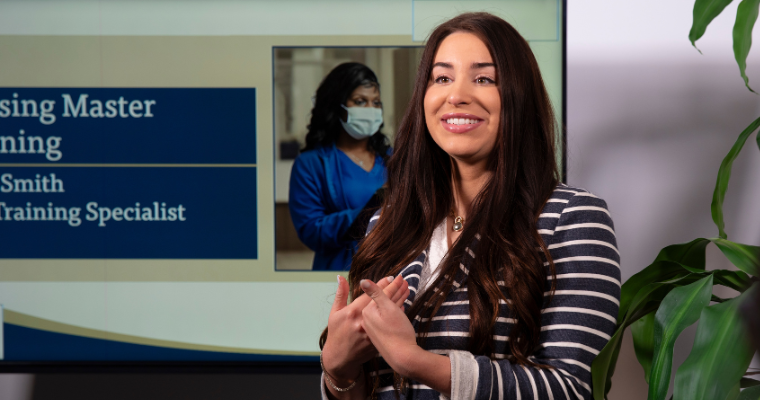 Julia Smith, alumni of the MBA in Health Care Administration online program, delivers a medical software presentation.
