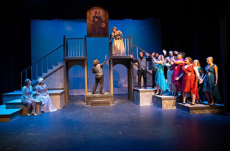 UL Lafayette theatre students perform onstage on a staircase