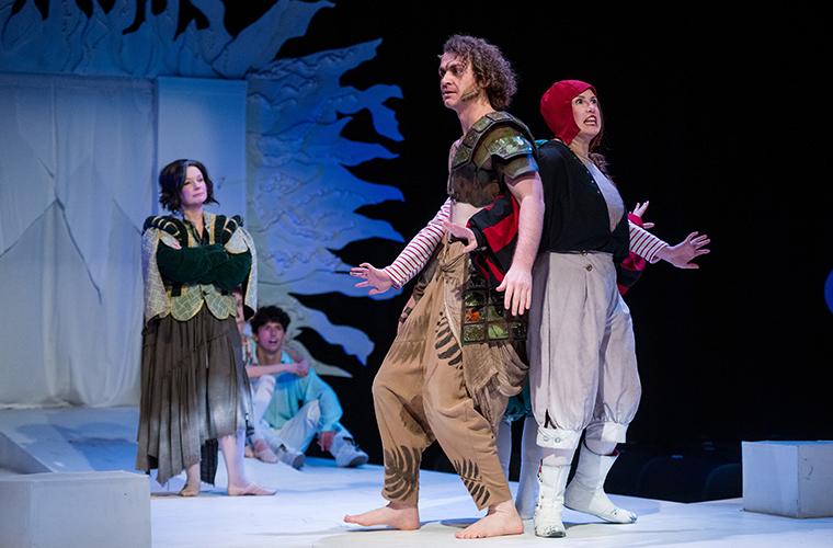 UL Lafayette students stand back-to-back onstage