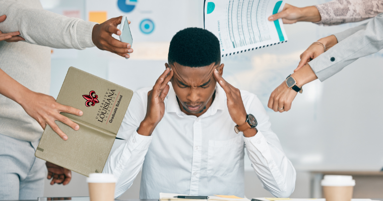 a man rubbing his temples while various people hand him work