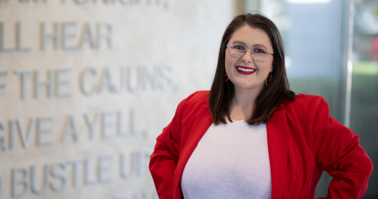 Chelsea Metzel, assistant program manager for UL Lafayette Online, smiles for a portrait in the Student Union on UL Lafayette's campus.