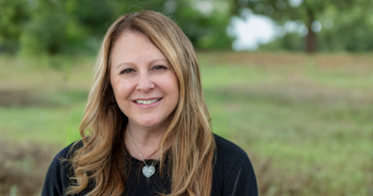 Dr. Tara Horsley, senior instructor and online RN to BSN program coordinator for UL Lafayette, smiles for a portrait outdoors.