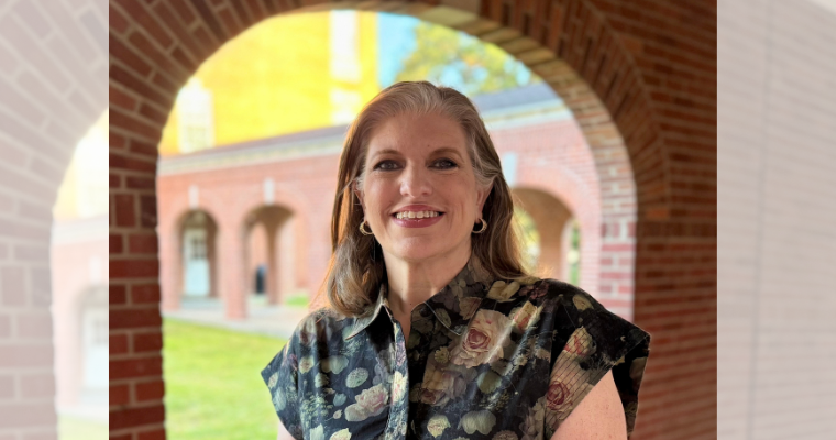 Head shot of Mary Baudoin on the UL Lafayette Campus under a brick walkway