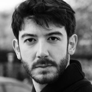 Headshot photograph of Giovanni Solinas