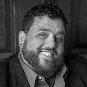 Portrait headshot photo of Marty Aiken
