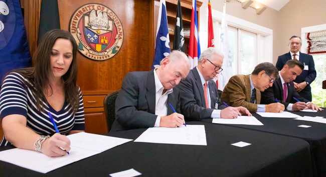 A signing ceremony for the UL Lafayette-UNamur student exchange