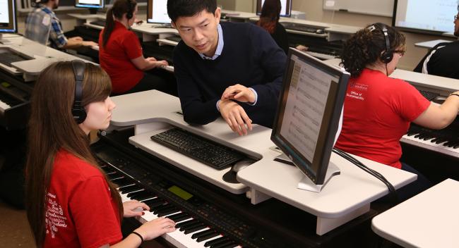 Chan Kiat Lim works with music student