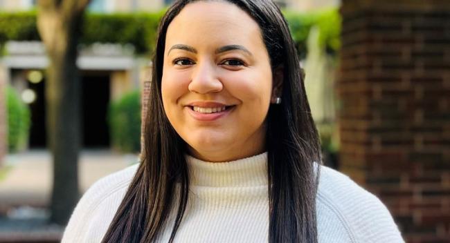 Olivia Larkins, MS, CHES, is an alumna of the online health promotion & wellness bachelor's program. Here, she poses for her headshot for her role as a health IT data analyst for the American Heart Association.