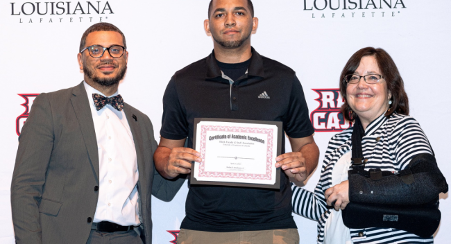 Clarence Chapman receives his 2023 Black Student Achievement Award.