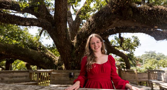 Portrait photo of Brooke Davenport in front of a massive tree