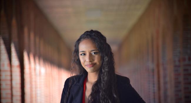 Corinne Salter is pictured under the brick archways of the quad at the University of Louisiana at Lafayette. Corinne earned her bachelor's degree in criminal justice from the University.