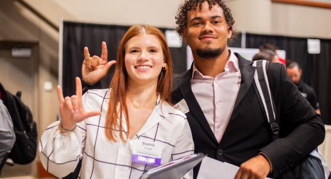 Two students attend the 2024 career fair.