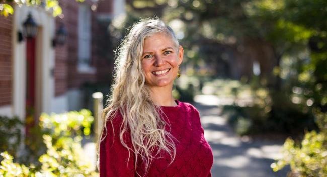 Dr. Emily Sandoz stands outside the Honors building on UL Lafayette's campus.
