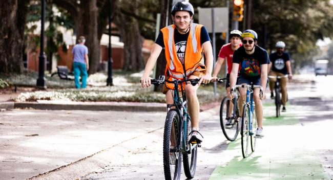 Gabe Griffard bikes down St. Mary Boulevard on the way to Moncus Park.