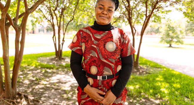 Nchedo Nwankwor on UL Lafayette's campus surrounded by trees.