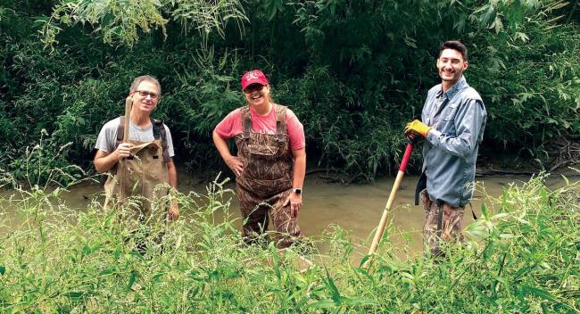 UL Lafayette Science Museum director Jennifer Hargrave, a volunteer and graduate student help to uncover a mastodon tooth in Church Point, Louisiana.