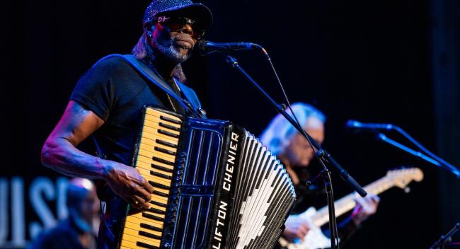 Zydeco frontman C.J. Chenier plays his father, Clifton Chenier's, iconic black-and-white accordion at a sold-out show at the Acadiana Center for the Arts.