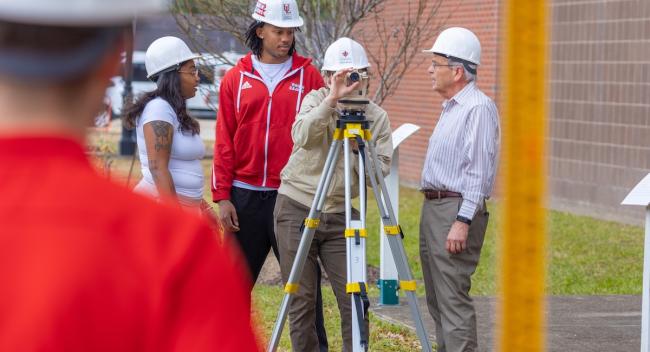 Engineering students and faculty on a job site