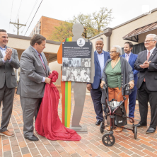 UL President Joseph Savoie, along side 4 men and one black American lady unveiling a marker at the corner of St. Mary Boulevard and Rex Street