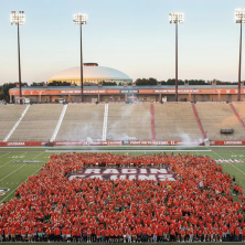 UL Freshman students stand out in the Cajun Field, all wearing red