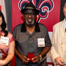Lee Allen Zeno accepting an award from the College of Arts