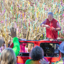 Doctor Savioe throwing beads at Mardi Gras