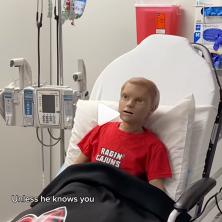 Nursing simulator child robot sits in medical bed