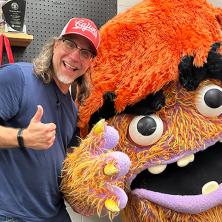 Scott Durbin poses with one of his puppet collector items