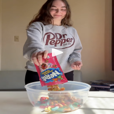 UL student pours nerds gummies into a candy salad bowl while sharing embarrassing UL stories