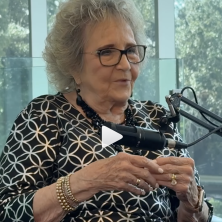 Janet Begneaud talks about Rauschenberg's centennial in front of a microphone