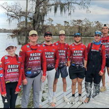UL Bass Fishing team poses in front of the Calcasieu River