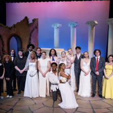 The UL cast of "Big Love" pose with their set