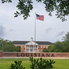 The American Flag lies above the University of Louisiana Lafayette Cricle