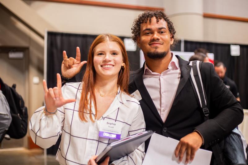 Two students attend the 2024 career fair.