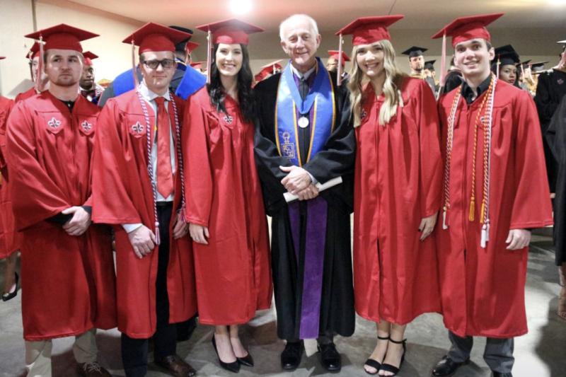 Oliver LeBlanc surrounded by students