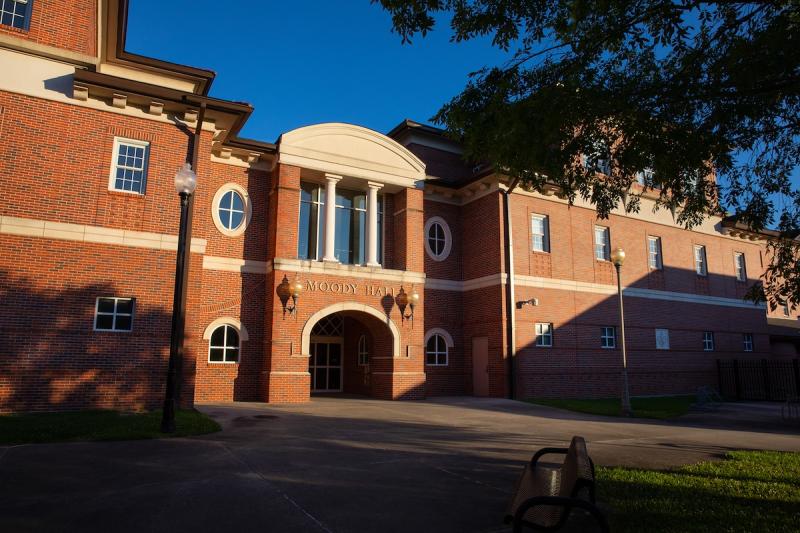 The exterior of a red-brick building, B.I. Moody III Hall