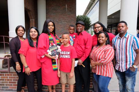 Kennette Toussaint with her family after receiving her Bachelor of General Studies.