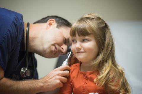 Family nurse practitioner Elliot Myers examines a child at his rural care clinic in Washington, La.